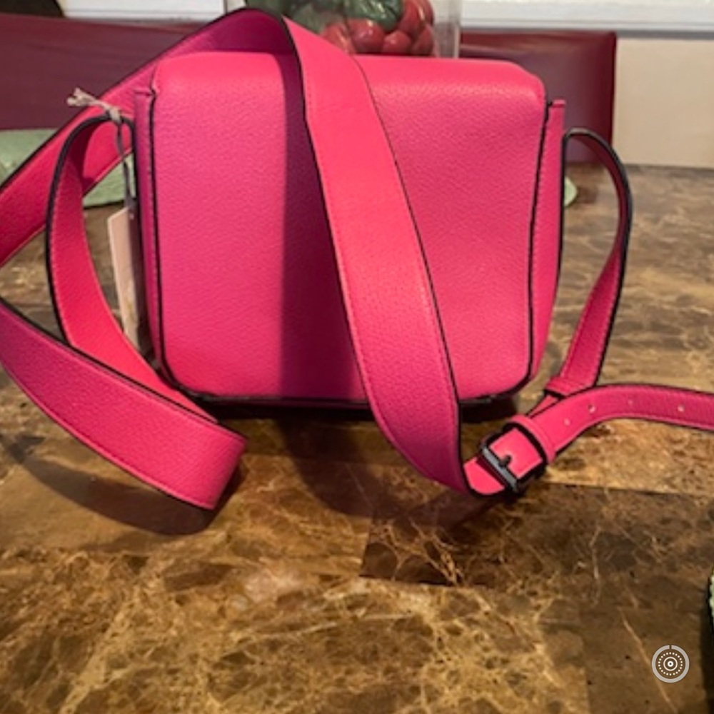 Women hot pink cross body bags.